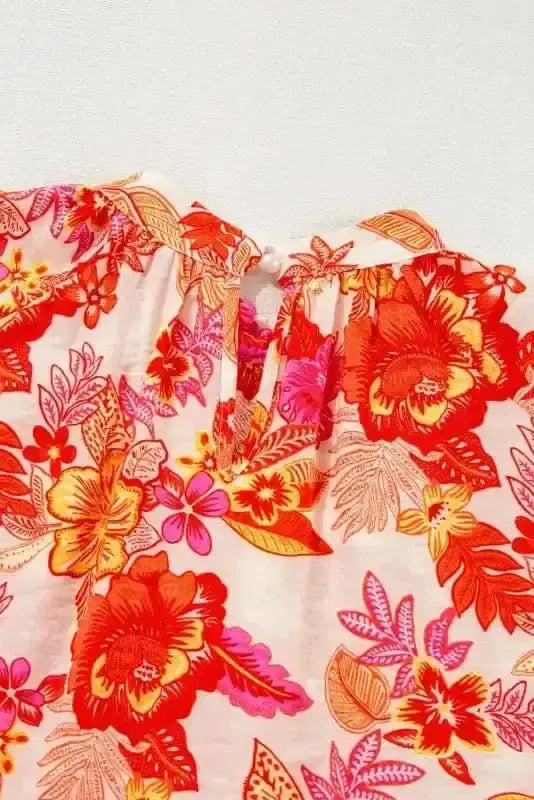 Close-up of Orange Floral Pearl Button Blouse showing lustrous pearl buttons and vibrant golden bloom floral on 81% viscose fabric — Fashionfitz
