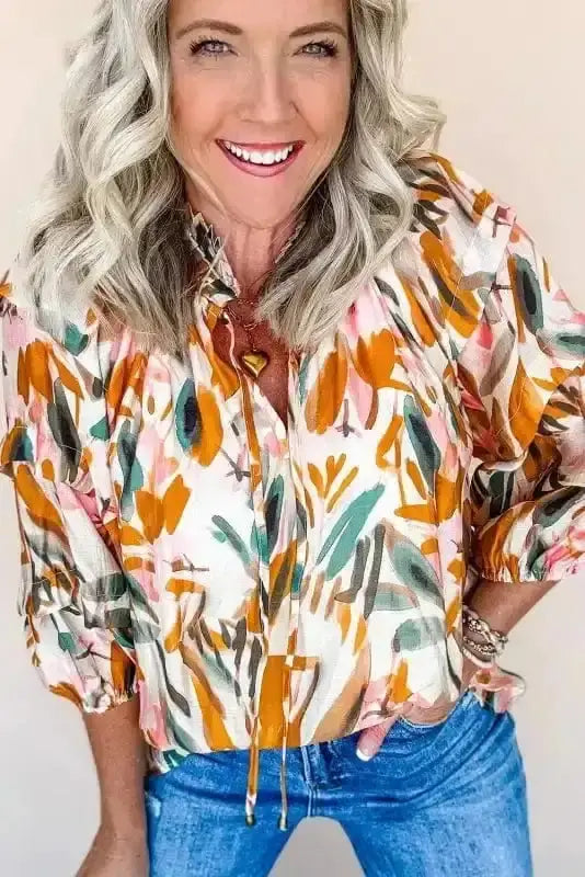 Close-up of Abstract Frilled V-Neck 3/4 Sleeve Blouse showing vivid orange abstract print and delicate frill detailing — Fashionfitz