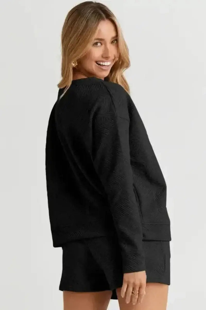 Back view of black ribbed loungewear set showing long sleeve top and matching ribbed shorts Fashionfitz UK