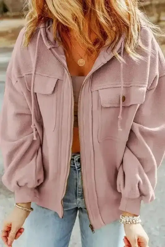 Front view of pink women's zip up hooded jacket with flap pockets and drawstring hood. Casual fleece coat perfect for daily wear.