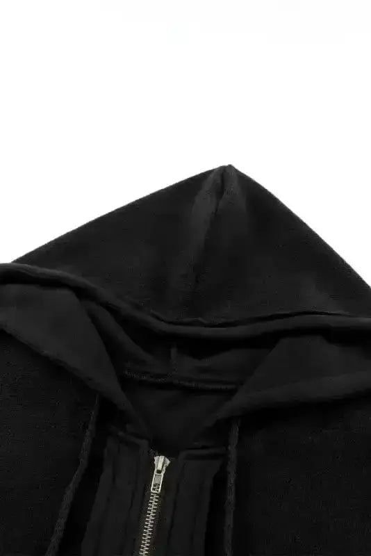 Drawstring hood detail of black zip up jacket for women, showing fleece-lined interior for added warmth.