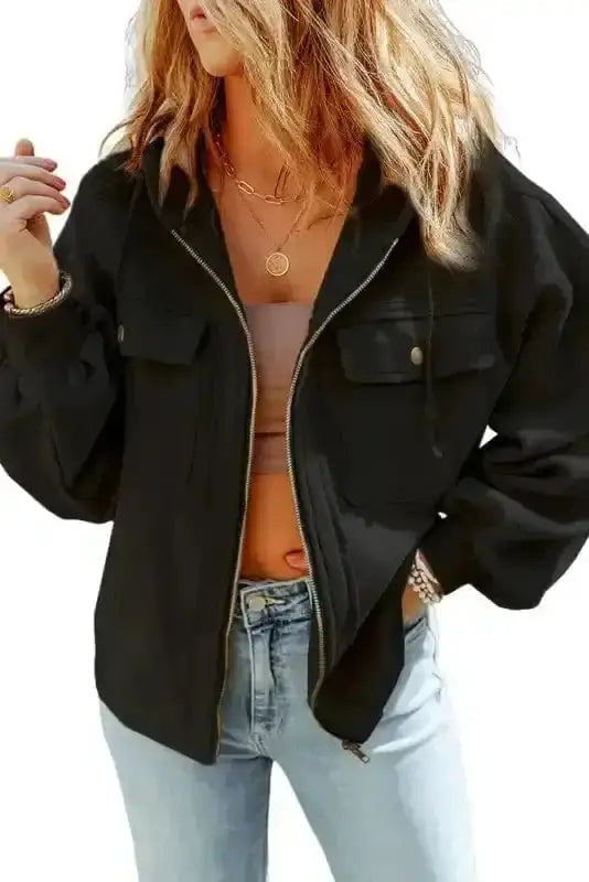 Casual black women's zip up hooded jacket featuring flap pockets and fleece fabric, ideal for cozy fall and winter outfits.