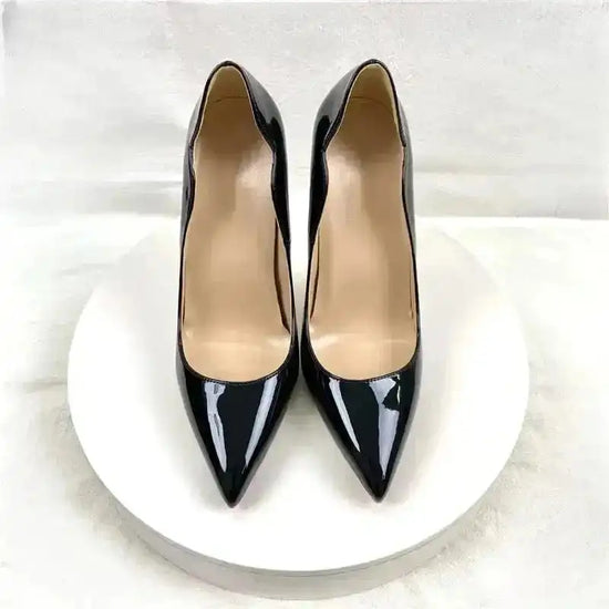Front view of Black Lacquer Leather Stiletto Pumps by FashionFitz showcasing pointed toe and smooth leather finish for chic appeal.