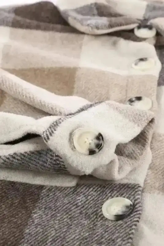 Detailed view of sleeve and button on women's plaid shacket, showing quality stitching and breathable material.