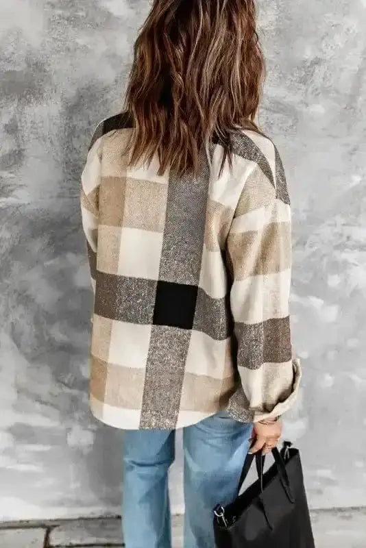 Back view of women's plaid button down jacket in beige and gray tones, showcasing relaxed fit and soft fabric texture.