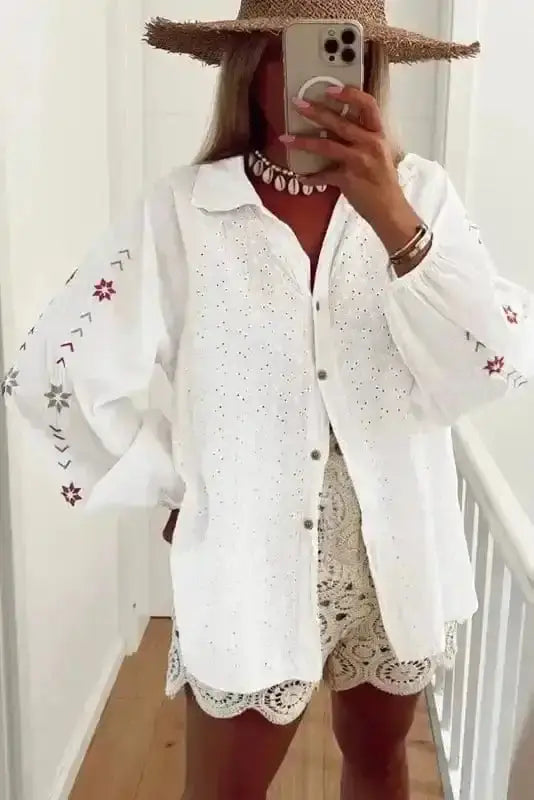 Side view of Cotton Floral Embroidered Puff Sleeve Shirt showing puff sleeve shape and ruffled detail — Fashionfitz