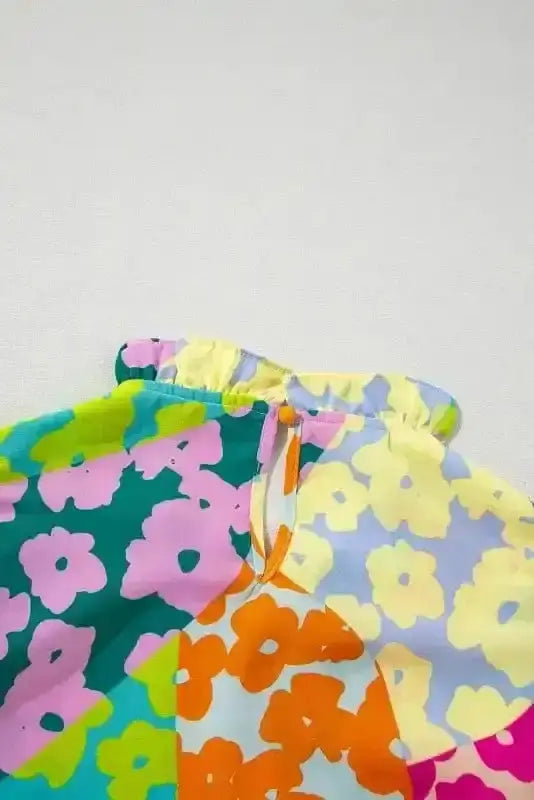 Close-up of Abstract Pleated Frilled Neck Flutter Blouse showing vibrant mosaic abstract print and frilled neckline detail — Fashionfitz