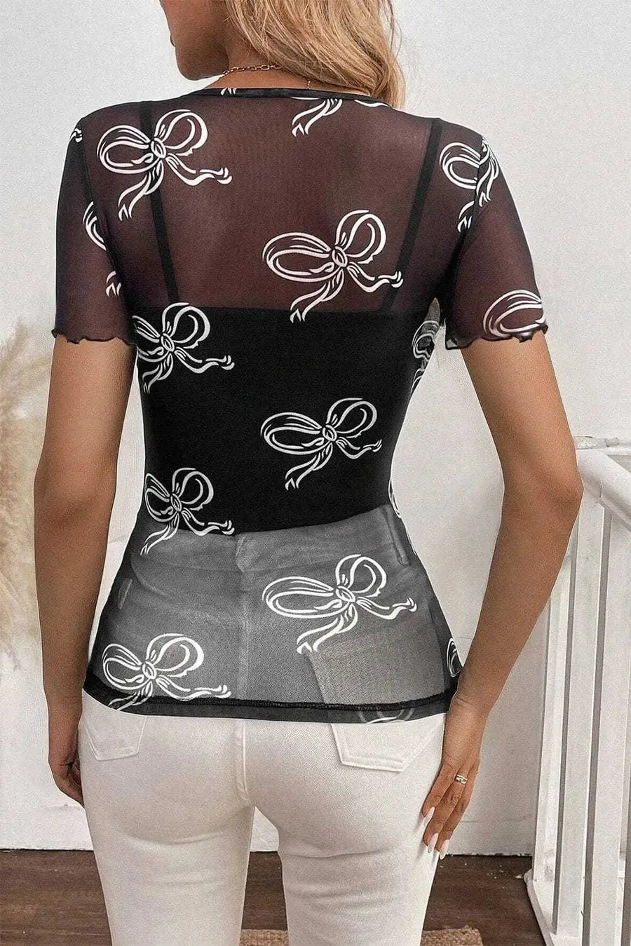 Back view of Black Bow Mesh Sheer Top showing sheer mesh construction and elegant fit — Fashionfitz