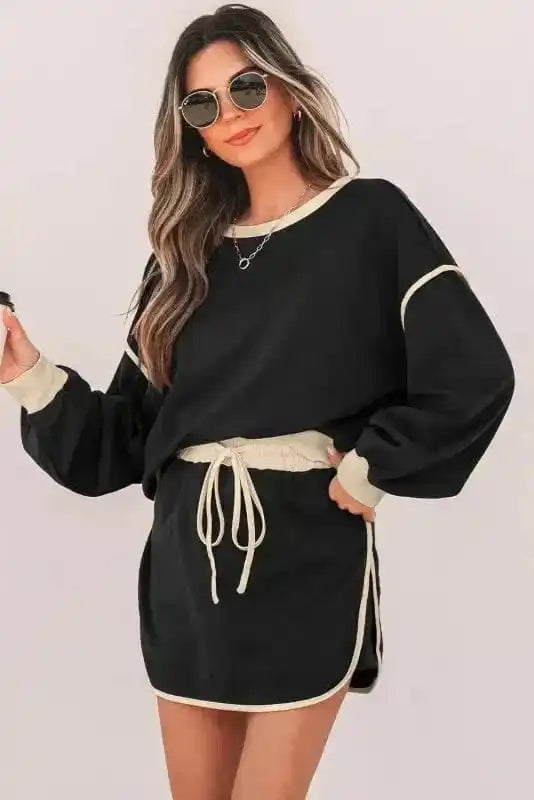 Two Piece Dresses Noir Chic Pullover and Skort Set