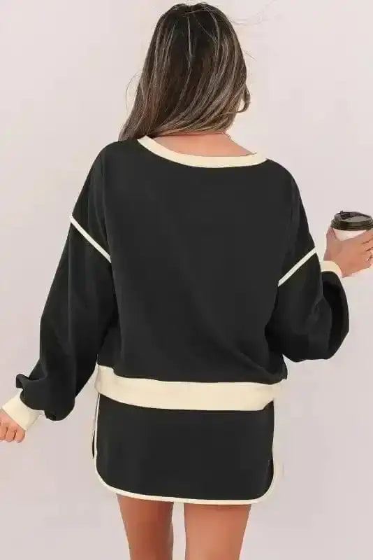 Two Piece Dresses Noir Chic Pullover and Skort Set