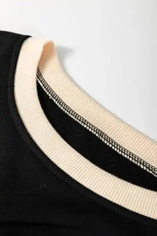 Two Piece Dresses Noir Chic Pullover and Skort Set