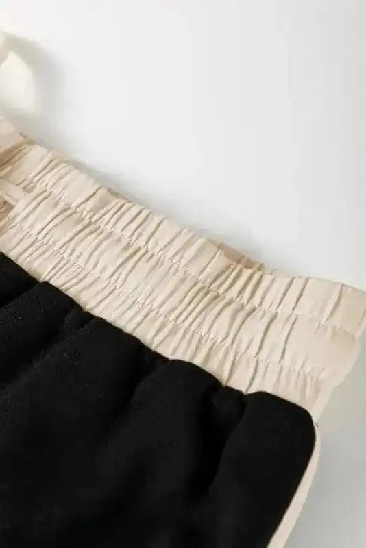 Two Piece Dresses Noir Chic Pullover and Skort Set