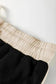 Two Piece Dresses Noir Chic Pullover and Skort Set