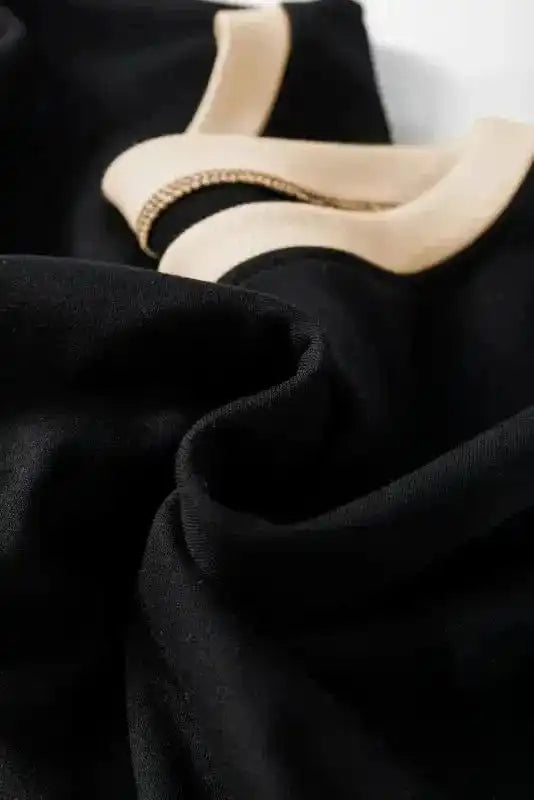 Two Piece Dresses Noir Chic Pullover and Skort Set