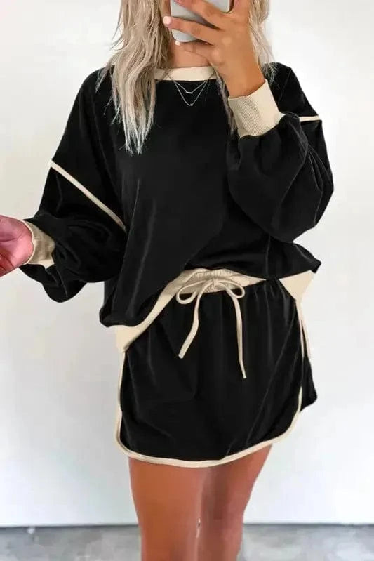 Two Piece Dresses Noir Chic Pullover and Skort Set