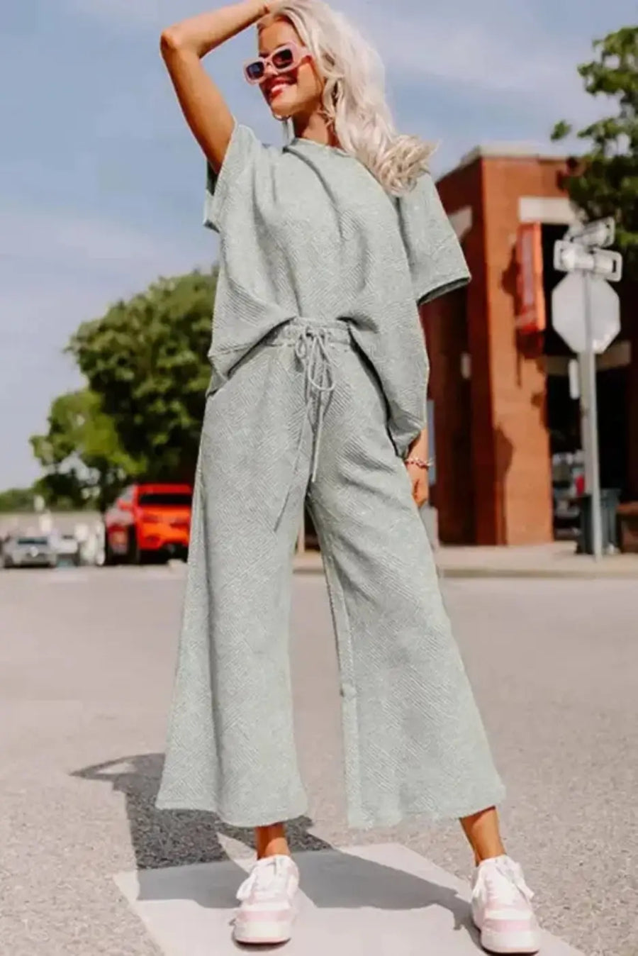 Flat lay of gray textured t-shirt and drawstring pants matching set showing fabric texture detail Fashionfitz UK