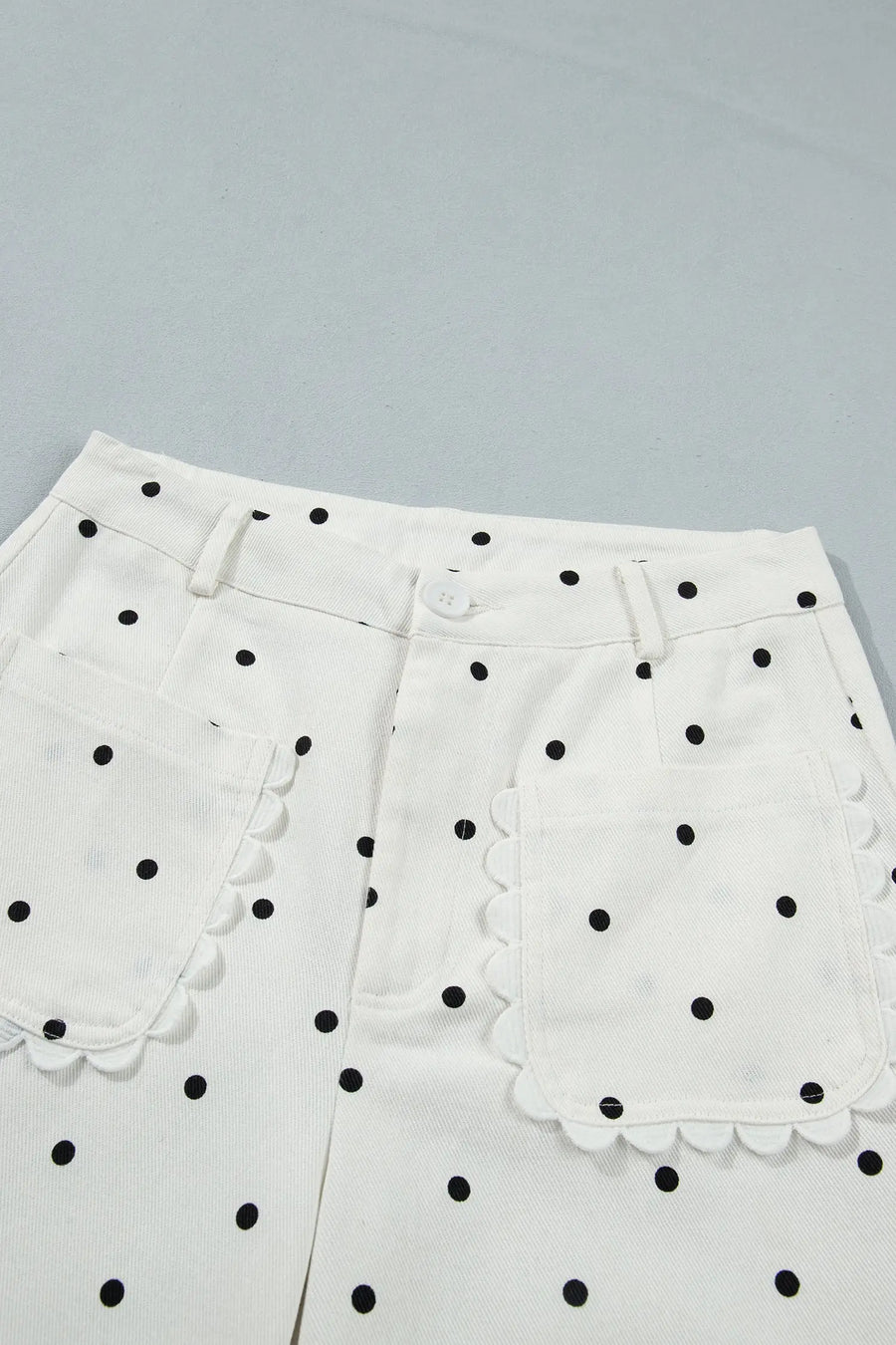 Women's polka dot scalloped pocket pants flat lay casual