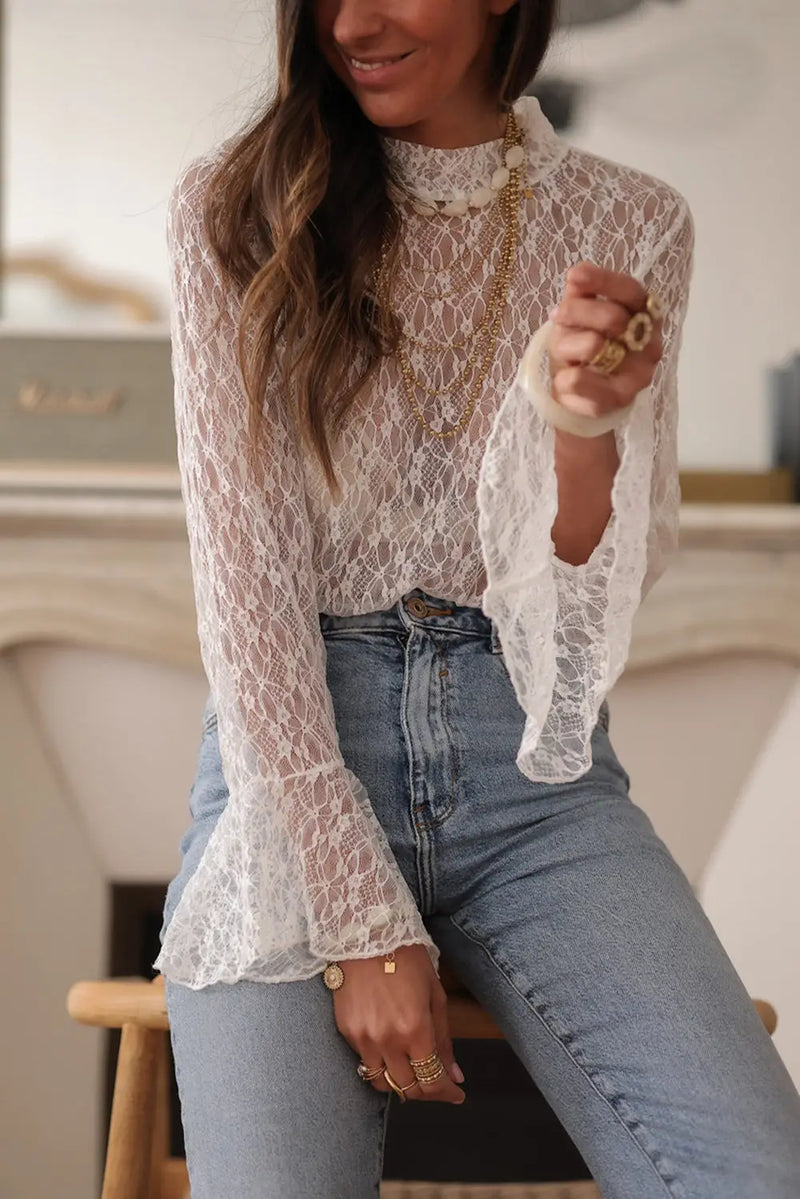 Back view of White Sheer Lace Bell Sleeve Mock Neck Blouse showing long bell sleeve silhouette and sheer lace — Fashionfitz