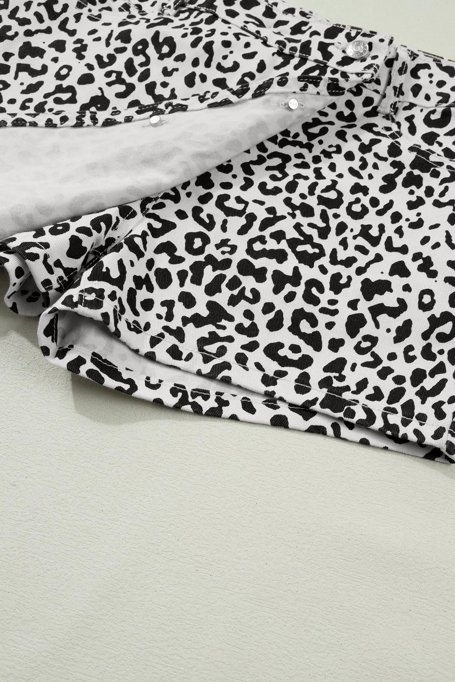 Black leopard print button overlap denim shorts