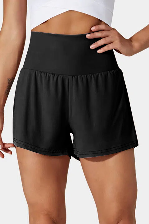 Woman wearing pocketed wide waistband swim shorts
