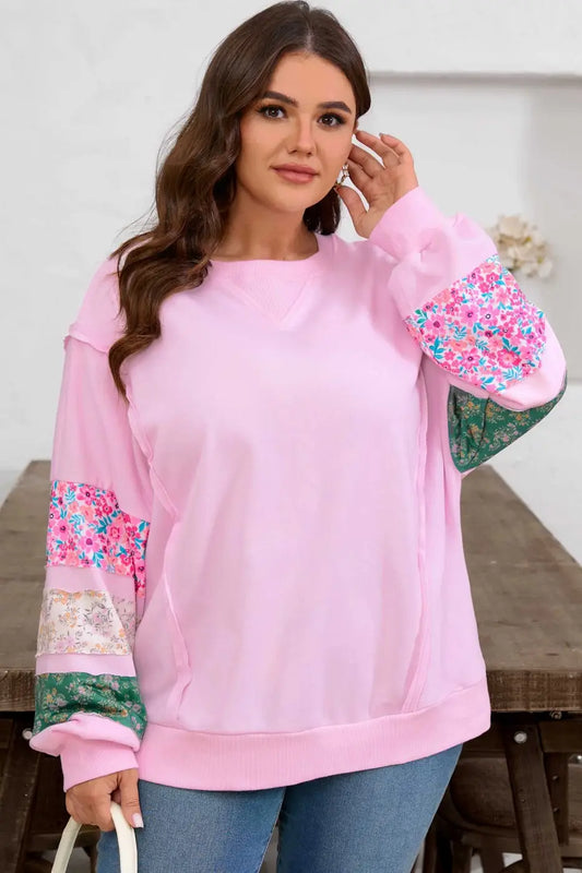 Curve Pink Floral Sleeve Baggy Sweatshirt for Women with multicolor floral patchwork sleeves, styled with jeans for a casual fall look.