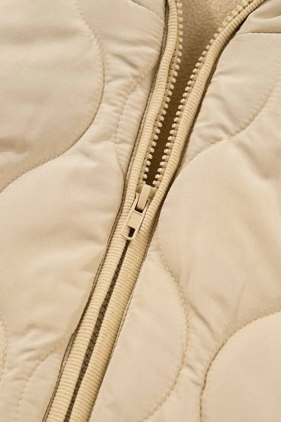Detail of khaki Quilted Fleece‑Lined Winter Gilet front zipper with curved quilted stitching and durable zip closure.