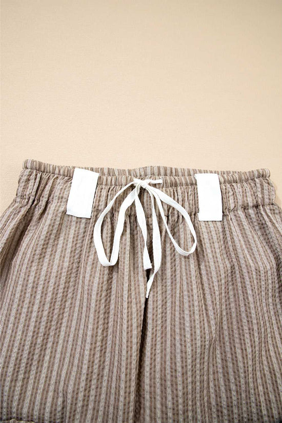 Close-up of drawstring waistband on Women's Brown Stripe Cargo Joggers, showing white tie and elastic band.