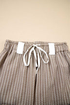 Close-up of drawstring waistband on Women's Brown Stripe Cargo Joggers, showing white tie and elastic band.