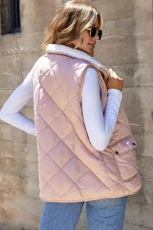 Back view of FashionFitz Women's Fleece Lined Quilted Vest Winter Gilet in pink, showing quilted stitching and flap pocket detail.