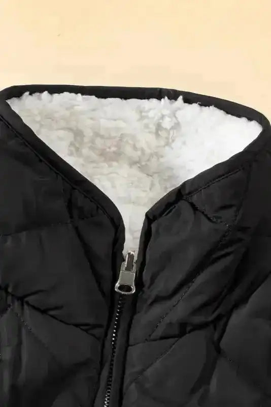 Close-up of black Women's Fleece Lined Quilted Vest Winter Gilet collar by FashionFitz, highlighting soft white sherpa lining and front zipper.