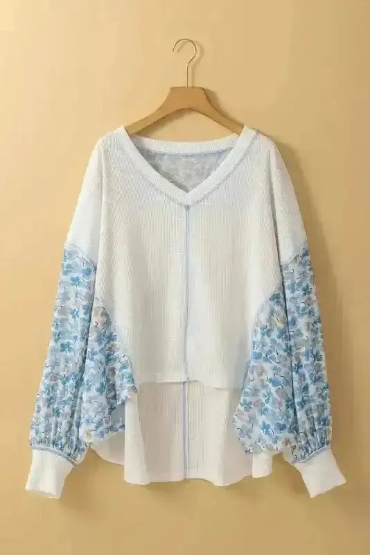 White Abstract Floral Batwing V-Neck Blouse Women UK styled as a bold distinctive casual outfit — Fashionfitz