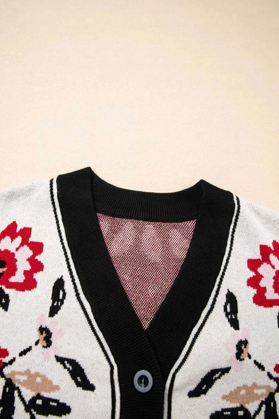 V-neckline detail of stretchable knit cardigan in soft beige