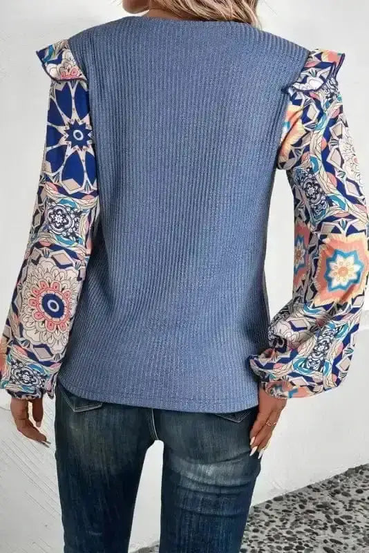 Back view of Floral Sleeve Waffle Knit Ruffle Blouse showing long floral sleeve and waffle knit silhouette — Fashionfitz