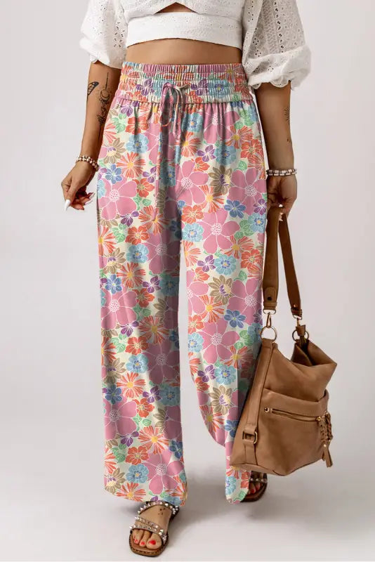 Colorful floral smocked waist wide-leg pants with elastic waistband and drawstring