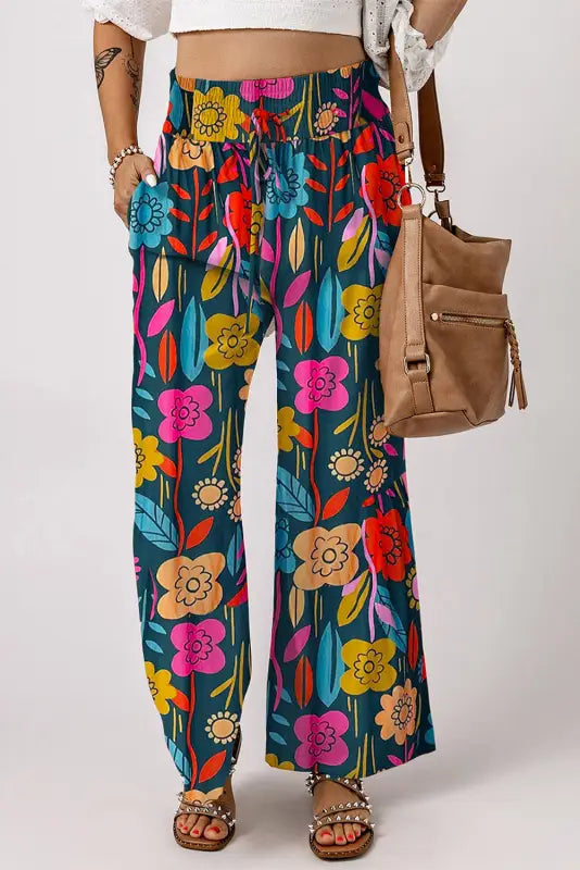 Relax relax in floral smocked waist loose pants with vibrant, retro-inspired floral print