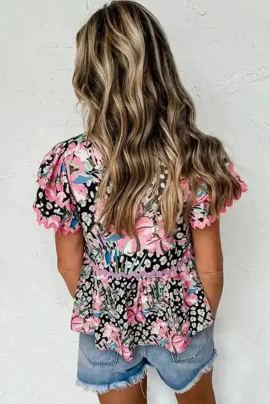 Back view of Floral Tiered Ricrac Blouse showing tiered layers with ricrac braid trim detail — Fashionfitz