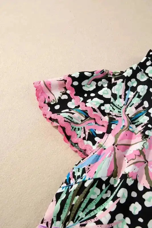 Close-up of Floral Tiered Blouse showing contrast ricrac braid trim on tiered layers and vibrant pink floral print — Fashionfitz