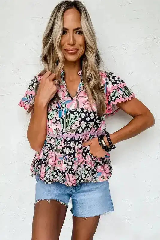 Side view of Floral Tiered Short Sleeve Blouse showing full flowy silhouette and split V-neckline — Fashionfitz