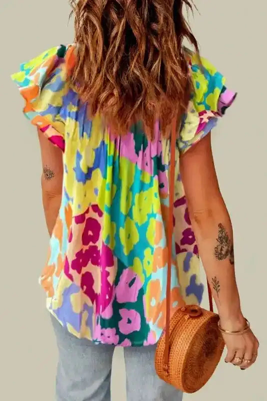 Side view of Leopard Flutter Sleeve Crinkled Blouse showing crinkled fabric texture and flowing fit — Fashionfitz