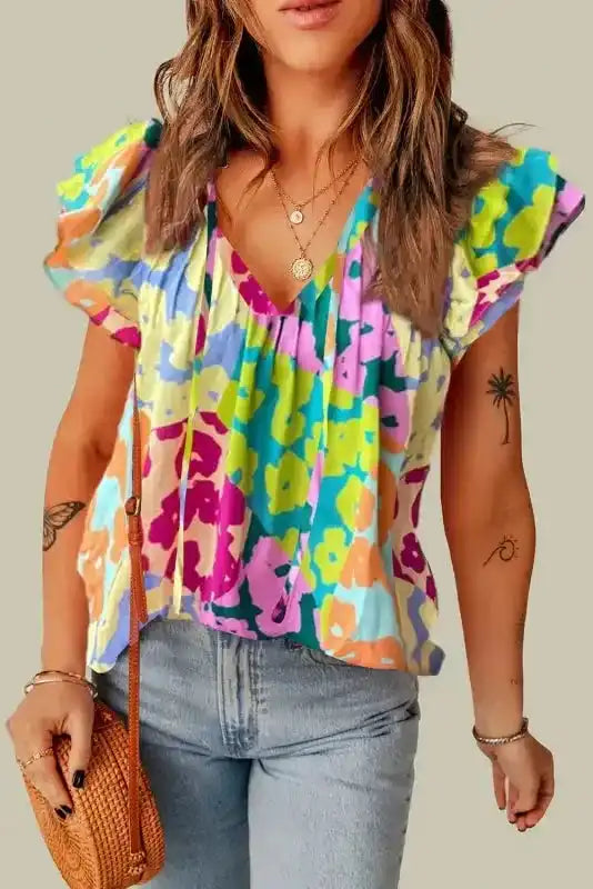 Back view of Leopard Patchwork Crinkled Blouse showing flutter sleeves and relaxed shift silhouette — Fashionfitz