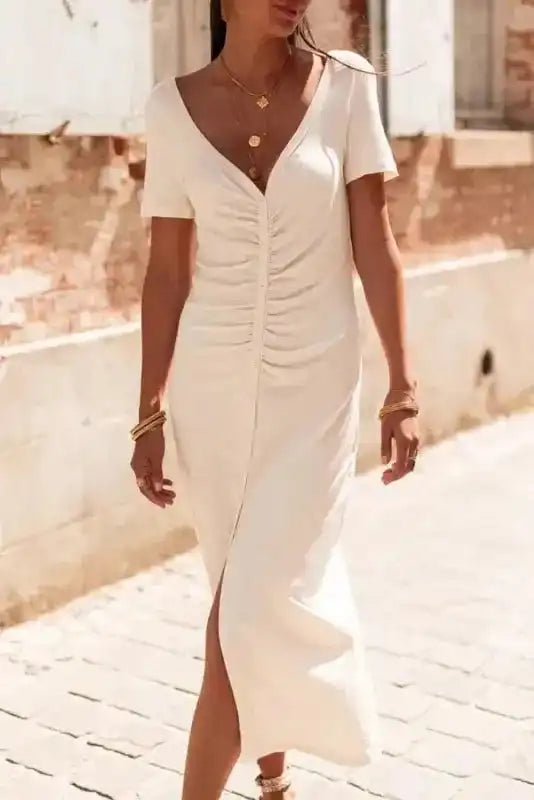 Beige French T-shirt Dress with V-neck and button front, featuring ruched detailing and short sleeves, ideal for summer fashion trends.