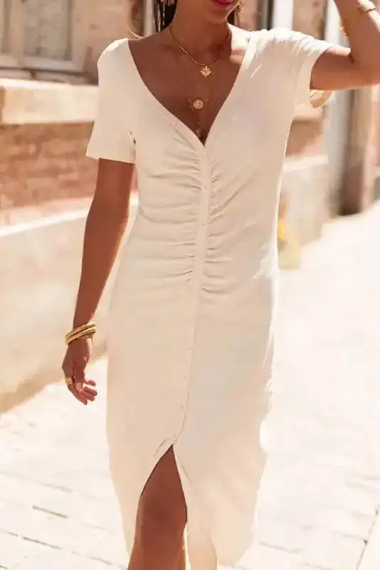 Close-up of Beige French T-shirt Dress highlighting V-neckline, button front, and ruched design for a flattering silhouette.