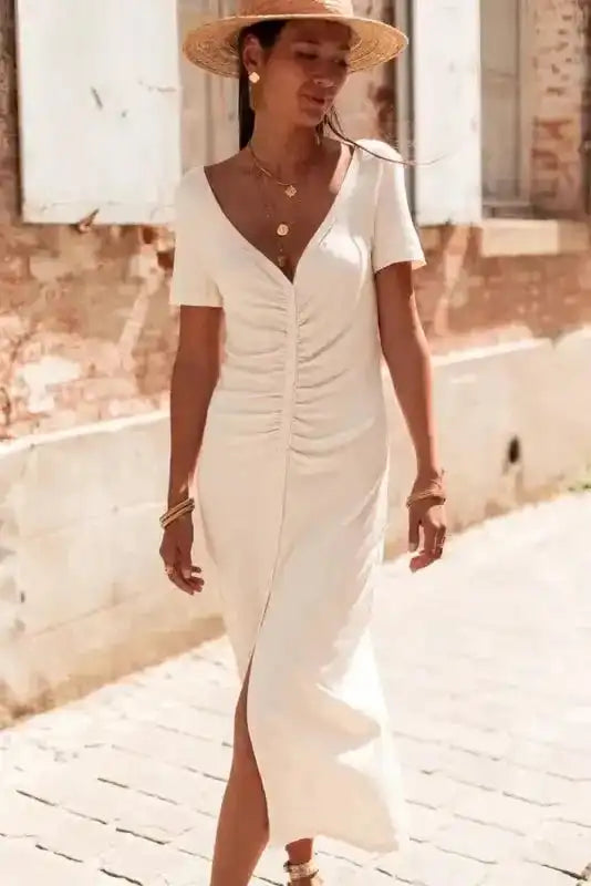 Casual summer outfit featuring Beige French T-shirt Dress with short sleeves and ruched front, ideal for warm-weather fashion.