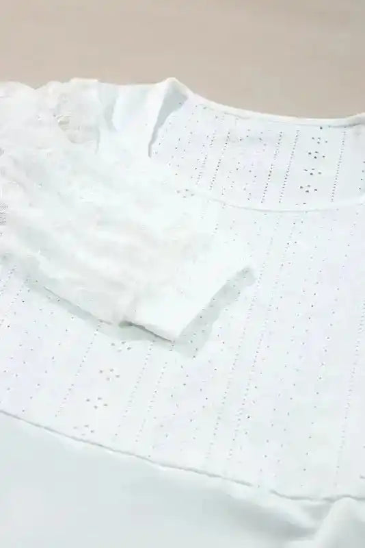 Detailed view of sleeve cuff and lace texture on Elegant Lace Sleeve Bodysuit, showcasing fine craftsmanship and elegant design.