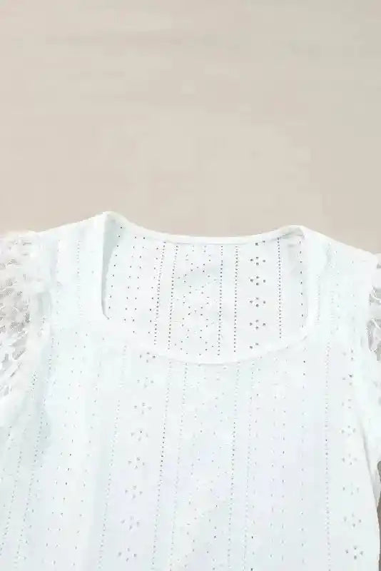 Close-up of neckline and lace detail on white Lace Sleeve Bodysuit, highlighting delicate embroidery and soft fabric texture.