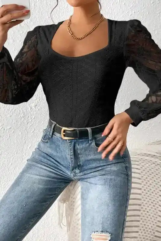 Model wearing Lace Sleeve Bodysuit with sheer sleeves and textured bodice, paired with jeans for a timeless outfit.