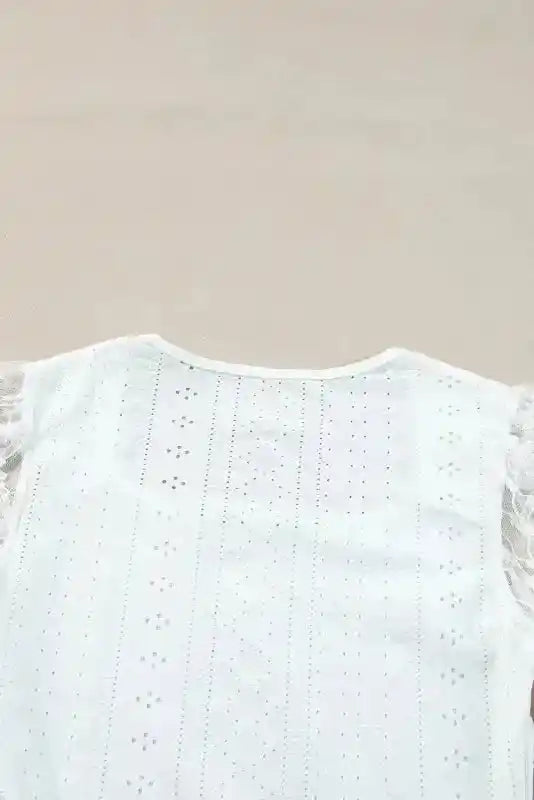 Back neckline and embroidery detail of Elegant Lace Sleeve Bodysuit, featuring soft fabric and refined lace pattern for timeless style.