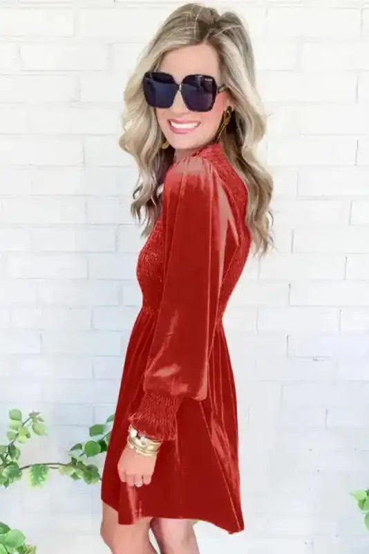 Side view of red Frilled Neck Smocked Bodice Velvet Dress by FashionFitz, showcasing smocked cuffs and soft velvet texture.