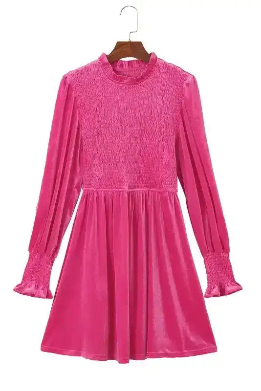 Full view of pink Frilled Neck Smocked Bodice Velvet Dress with long sleeves and A-line silhouette, perfect for elegant winter wear.