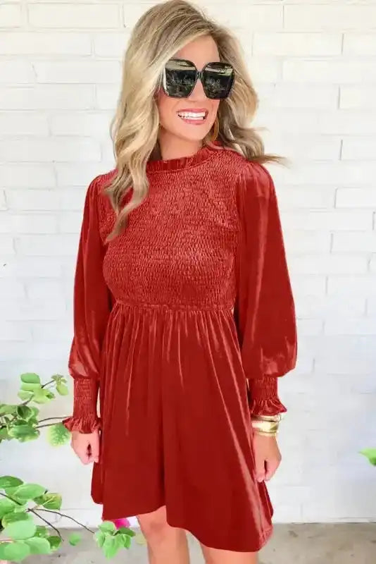 Front view of red velvet mini dress with frilled neckline and smocked bodice, ideal for daily or evening wear.